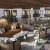 rendering of outdoor lounge space showing ample seating, modern decor and easy access to the pool